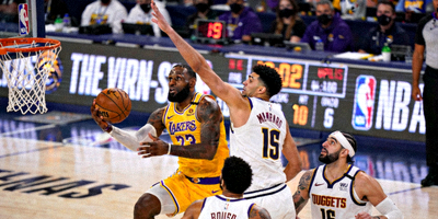NBA西部决赛湖人对阵掘金比赛现场图片，球员激烈对抗瞬间